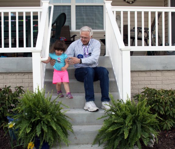 Julia on the back steps with P-Paw